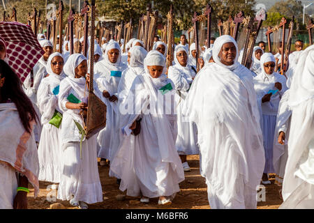 A Procession Of Female Ethiopian Christians Carrying Begenas Arrive At The Jan Meda Sportsgound To Celebrate Timkat (Epiphany), Addis Ababa, Ethiopia Stock Photo