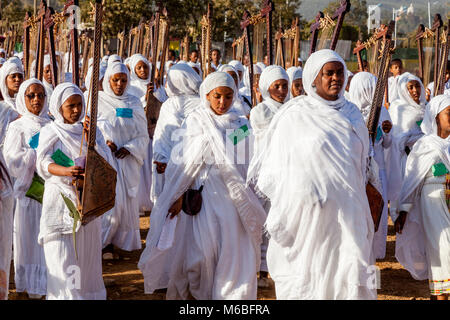 A Procession Of Female Ethiopian Christians Carrying Begenas Arrive At The Jan Meda Sportsgound To Celebrate Timkat (Epiphany), Addis Ababa, Ethiopia Stock Photo