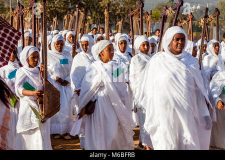 A Procession Of Female Ethiopian Christians Carrying Begenas Arrive At The Jan Meda Sportsgound To Celebrate Timkat (Epiphany), Addis Ababa, Ethiopia Stock Photo