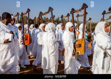 A Procession Of Female Ethiopian Christians Carrying Begenas Arrive At The Jan Meda Sportsgound To Celebrate Timkat (Epiphany), Addis Ababa, Ethiopia Stock Photo