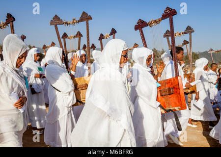 A Procession Of Female Ethiopian Christians Carrying Begenas Arrive At The Jan Meda Sportsgound To Celebrate Timkat (Epiphany), Addis Ababa, Ethiopia Stock Photo