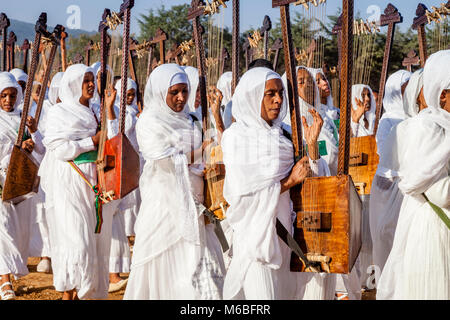 A Procession Of Female Ethiopian Christians Carrying Begenas Arrive At The Jan Meda Sportsgound To Celebrate Timkat (Epiphany), Addis Ababa, Ethiopia Stock Photo