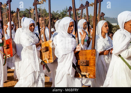 A Procession Of Female Ethiopian Christians Carrying Begenas Arrive At The Jan Meda Sportsgound To Celebrate Timkat (Epiphany), Addis Ababa, Ethiopia Stock Photo