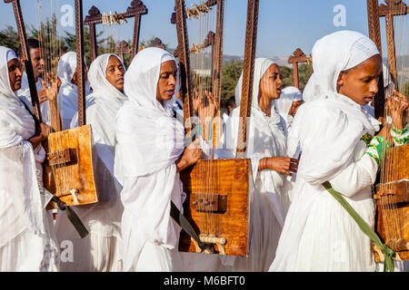 A Procession Of Female Ethiopian Christians Carrying Begenas Arrive At The Jan Meda Sportsgound To Celebrate Timkat (Epiphany), Addis Ababa, Ethiopia Stock Photo