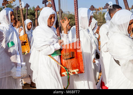 A Procession Of Female Ethiopian Christians Carrying Begenas Arrive At The Jan Meda Sportsgound To Celebrate Timkat (Epiphany), Addis Ababa, Ethiopia Stock Photo