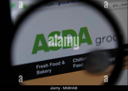 The Asda supermarket website seen through a magnifying glass Stock Photo