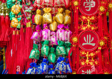 LONDON, UK - FEB. 18, 2018: Display of holy sacred decorative hanging objects for festival season and Chinese New Year in China town, London, UK. Stock Photo