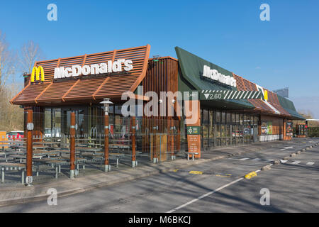 Exterior of modern Mc Donald's fastfood restaurant with drive-thru Stock Photo