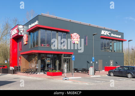 Car park near Dutch motorway with KFC fastfood restaurant Stock Photo