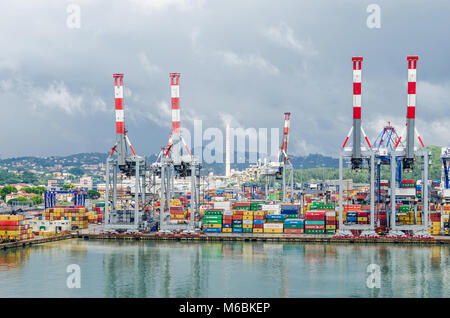 La Spezia, Italy - May 29, 2016:  View of the city La Spezia, the chief Italian naval station and arsenal, from the sea, showing commercial port with  Stock Photo