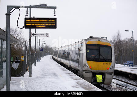 A Chiltern Railways class 168 train leaving Warwick Parkway station in winter, Warwickshire, UK Stock Photo