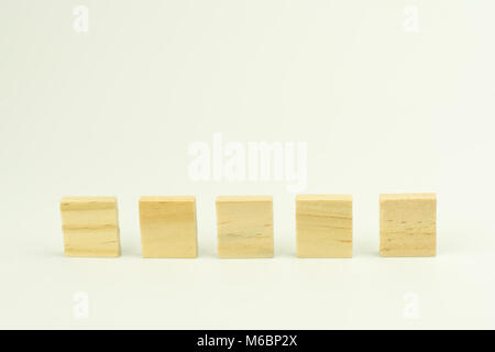 Row of five blank wooden blocks on a white background with copyspace for your text Stock Photo
