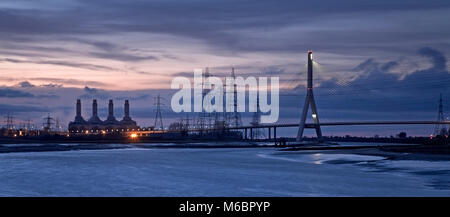 Suspension bridge, power station and pylons at Deeside, North Wales on the banks of the river Dee Stock Photo