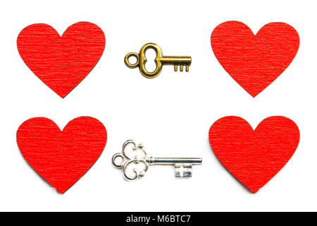 Old key with a heart  isolated on white background. Stock Photo