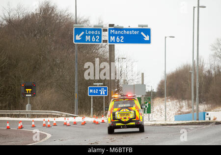 A police car blocks the slip road at Junction 21 of the M62 in Milnrow after a section of the motorway was closed, as the severe weather conditions continue. Stock Photo