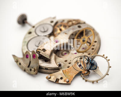 It’s Spring Time!. Antique pocket watch in pieces and in need of a new spring. Stock Photo
