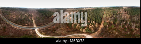 Composite panorama of aerial photographs and aerial photos of a forest area with spruce, pine and fir trees in the heath, abstract effect through a 36 Stock Photo