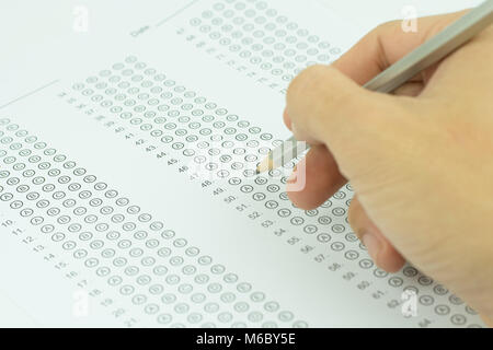 Man Tested Form man hands filling in standardized test form Stock Photo - Alamy