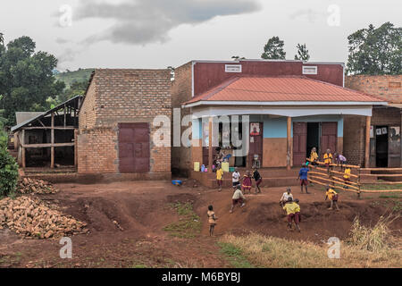 Children in school uniform playing Hoima Village en route from Murchisons falls National Park to Kimbale National Park south-west Uganda Africa Stock Photo