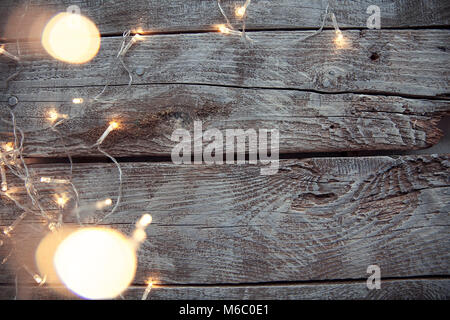 Light bulbs on light and old wooden background Stock Photo