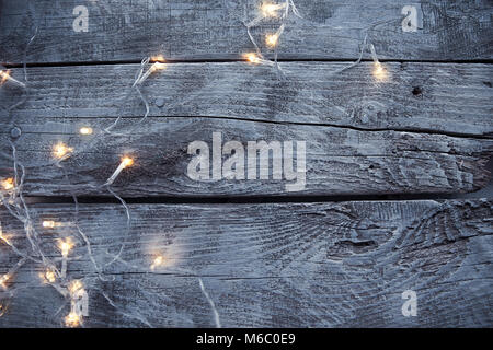 Light bulbs on light and old wooden background Stock Photo