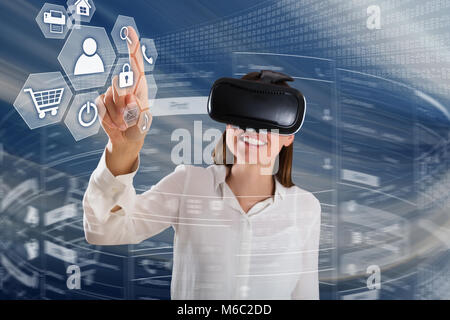 Close-up Of A Happy Young Woman Wearing Virtual Reality Glasses Using Innovative Technologies Stock Photo