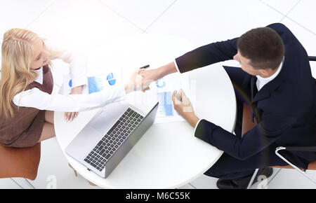 handshake colleagues after drawing up a new financial plan Stock Photo