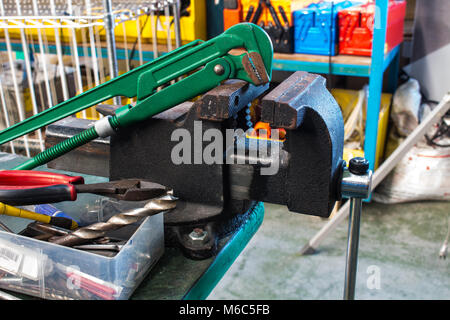 The straight pipe wrench and Bench Vise Stock Photo