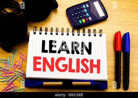 Conceptual hand writing text caption showing Learn English. Business concept for Language School written on notebook book on the background in the Off Stock Photo