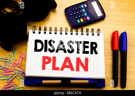 Conceptual hand writing text caption showing Disaster Plan. Business concept for Emergency Recovery written on notebook book on the background in the  Stock Photo