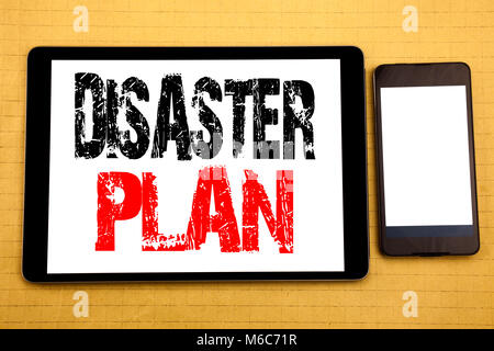 Hand writing text caption inspiration showing Disaster Plan. Business concept for Emergency Recovery Written on tablet, wooden background with sticky  Stock Photo