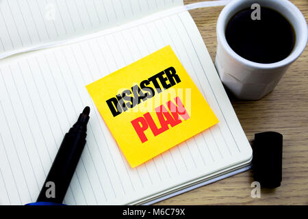 Hand writing text caption inspiration showing Disaster Plan. Business concept for Emergency Recovery written sticky note paper, Wooden background with Stock Photo