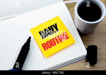 Hand writing text caption inspiration showing Daily Routine. Business concept for Habitual Lifestyle written sticky note paper, Wooden background with Stock Photo