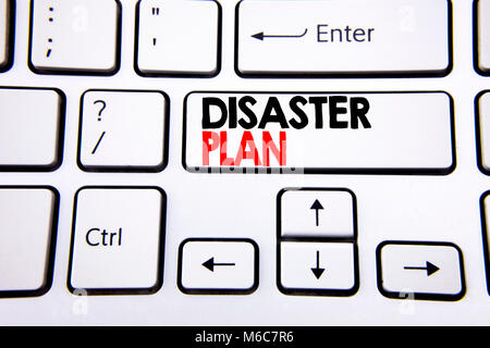 Hand writing text caption inspiration showing Disaster Plan. Business concept for Emergency Recovery written on white keyboard key with copy space. To Stock Photo