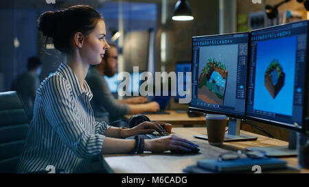 Female Video Editor Works with Footage and Sound on Her Personal Computer. She Works Late and Drinks Coffee. Creative Modern Loft Office. Stock Photo