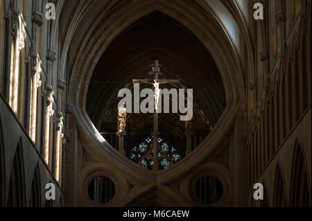 Statue of Jesus Christ on the cross on one of the scissor arches in Wells Cathedral, Wells, Somerset, UK. Stock Photo