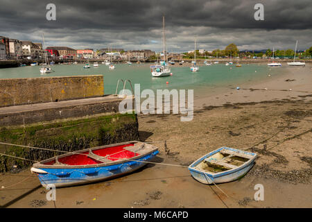 Boats at low tide in Dungarven harbour, Ireland Stock Photo