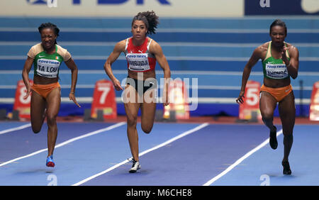 Ivory Coast's Murielle Ahoure (right) on her way to winning gold in the Women's 60m final ahead of second placed Ivory Coast's Marie-Josee Ta Lou (left) and third placed Switzerland's Mujinga Kambundji during day two of the 2018 IAAF Indoor World Championships at The Arena Birmingham. Stock Photo