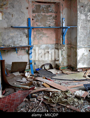 Derelict room filled with rubbish Stock Photo