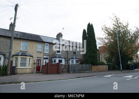 a typical english terraced row of houses in Cambridgeshire with a bay window, double glazing and a block paving driveway. Stock Photo