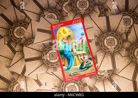 Moscow, Russia - February 18, 2018: Tarot card King of Pentacles. Dragon tarot deck. Esoteric mysterious background in gothic style Stock Photo