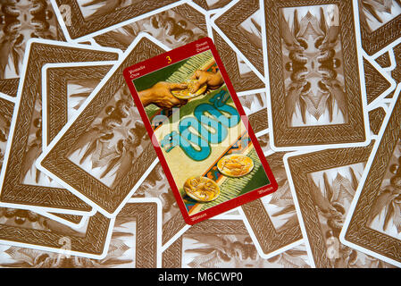 Moscow, Russia - February 18, 2018: Tarot card Three of Pentacles. Dragon tarot deck. Esoteric mysterious background in gothic style Stock Photo