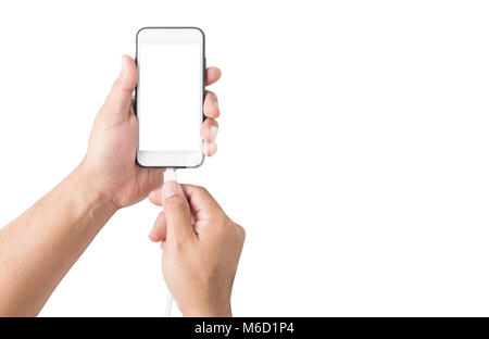 Hand holding smartphone and connect charger isolated on white background, clipping path and copy space Stock Photo