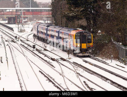 Southampton, UK. 2nd Mar, 2018. The delayed 12:38 South Western Railway service from Portsmouth & Southsea, due to arrive Southampton Central at 13:38, departs St Denys station 55 minutes late in heavy snow. South Western Railway is running a reduced service due to heavy snow from Storm Emma. Passengers are being advised not to travel and the service will close down by 20:00. Credit: James Hughes/Alamy Live News Stock Photo