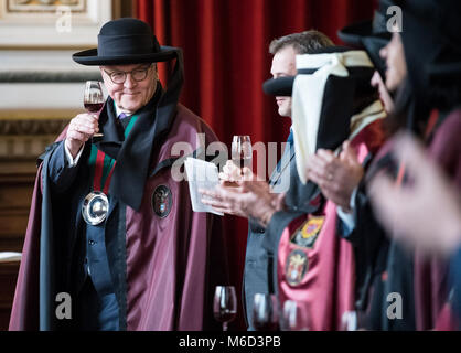 02 March 2018, Portugal, Porto: German President Frank-Walter Steinmeier (L) drinks a glass of port wine during the ceremony of the port wine brotherhood. Previously, Steinmeier became a member of the port wine brotherhood. German President Steinmeier is in Portugal for a two-day visit. Photo: Bernd von Jutrczenka/dpa Stock Photo