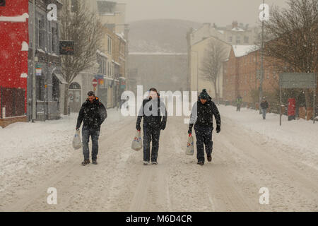 Cardiff, Wales,UK. 2nd March 2018. Pedestrians venture out in Cardiff, Following a night of heavy snow and blizzard conditions. Cardiff has been given a red weather alert due to Storm Emma, known also as the Beast from the East. Further snow and bad weather is forecasted throughout the night. Cardiff, Wales,UK. Credit: Haydn Denman/Alamy Live News Stock Photo