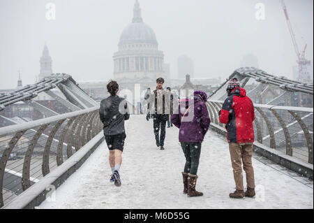 London, UK. 2nd Mar, 2018. People seen at the Millenium Bridge under snowy weather. Credit: B Rouco-3090.jpg/SOPA Images/ZUMA Wire/Alamy Live News Stock Photo