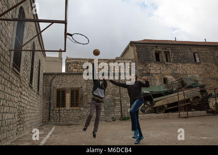 Homs, Syria. 31st Oct, 2017. Men with Down's Syndrome play basketball, as part of a programme for young people with disabilities. During heavy fighting, many of the men weren't able to leave home, something which has had negative mental impacts.The city of Homs which is located in the center of Syria was once a anti Assad government real forces' strong hold, It was under the rebel's hand from 2011 until 2014. Credit: S Hayden 010318 12.jpg/SOPA Images/ZUMA Wire/Alamy Live News