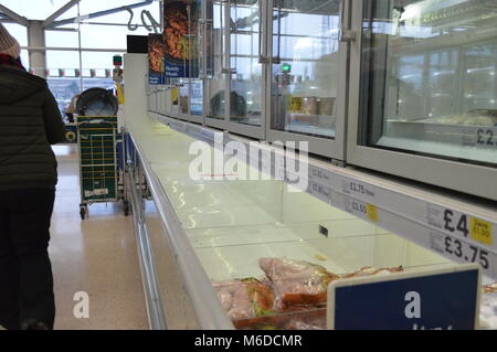 Swansea UK, 2nd March 2018, Panic buying empties shelves in Tesco supermarket, snow day, Credit: Ian Thomas/Alamy Live News Stock Photo