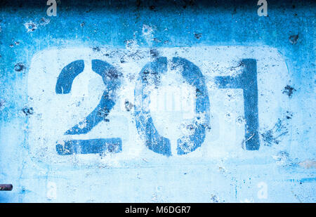 the number 2 0 1 on the blue wall, two hundred and one Stock Photo